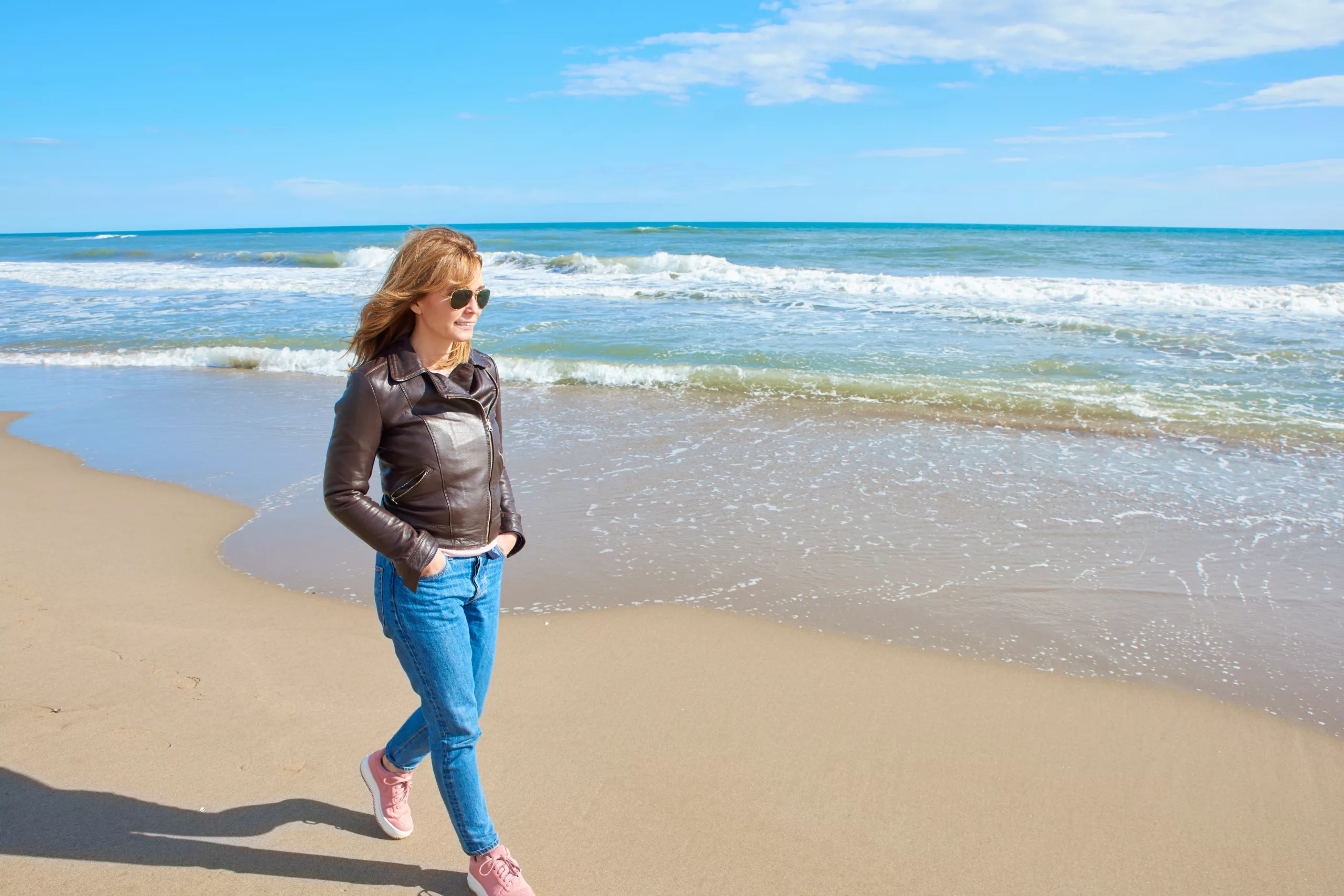 Person in active wear walking outside in natural light, post weight loss