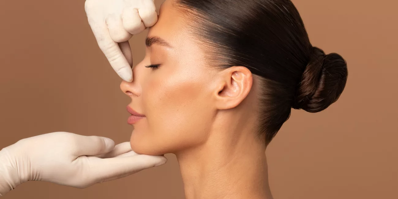 Woman in soft natural light, mature, considering facelift surgery