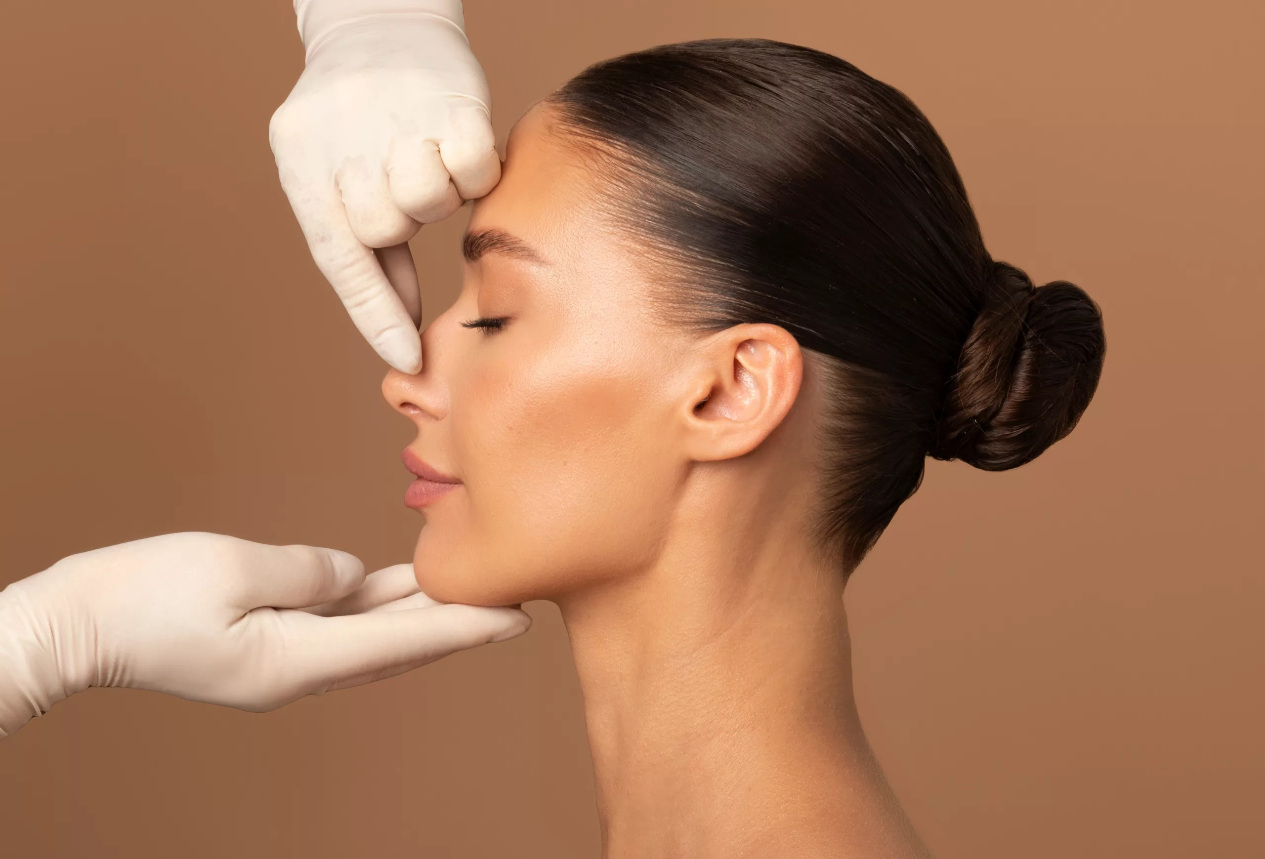 Woman in soft natural light, mature, considering facelift surgery