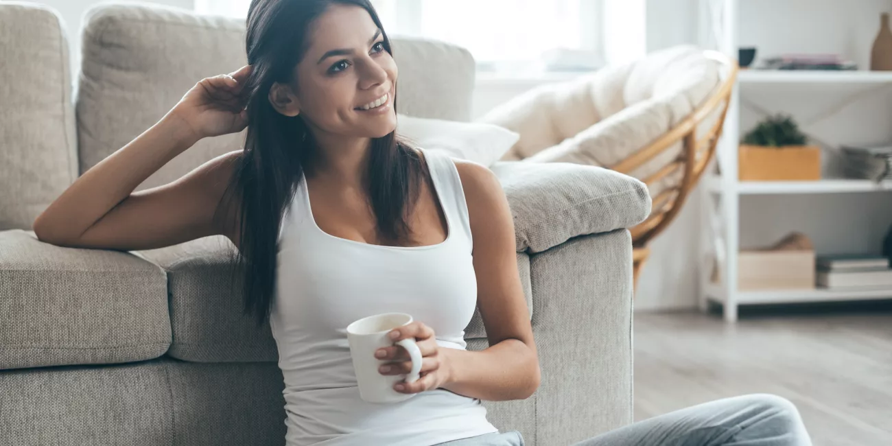Woman in active wear in natural light, considering body contouring options