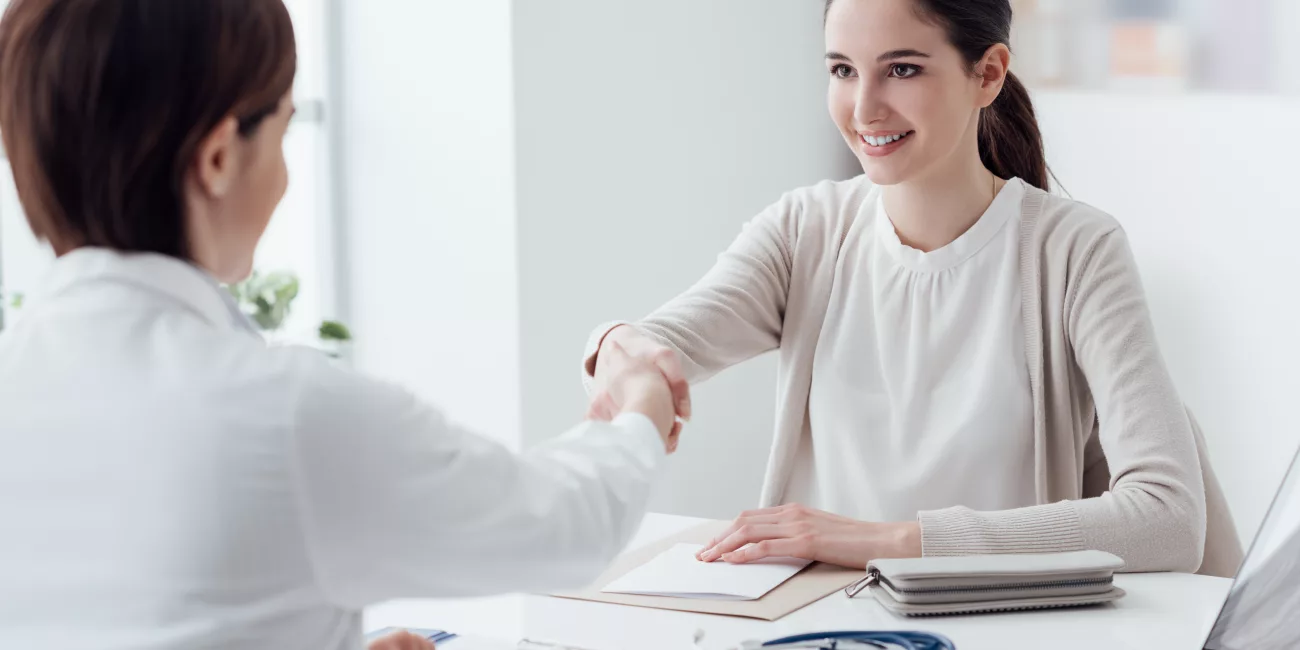 Patient in calm consultation with cosmetic surgeon, professional setting