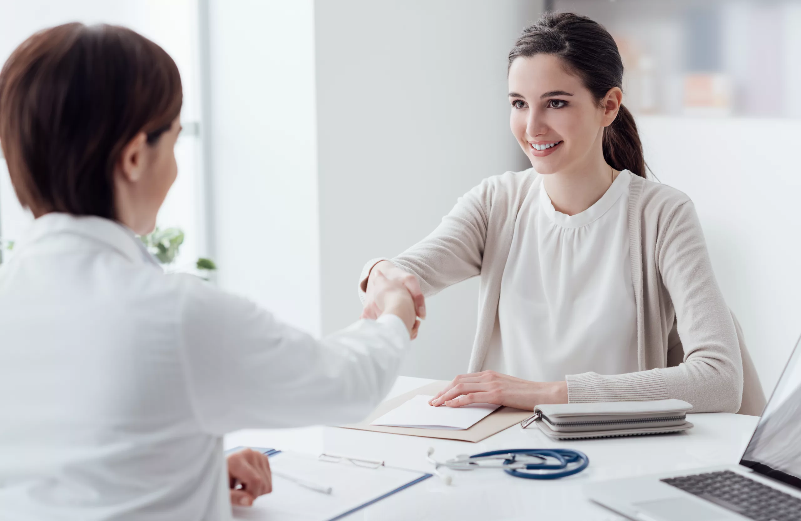 Patient in calm consultation with cosmetic surgeon, professional setting